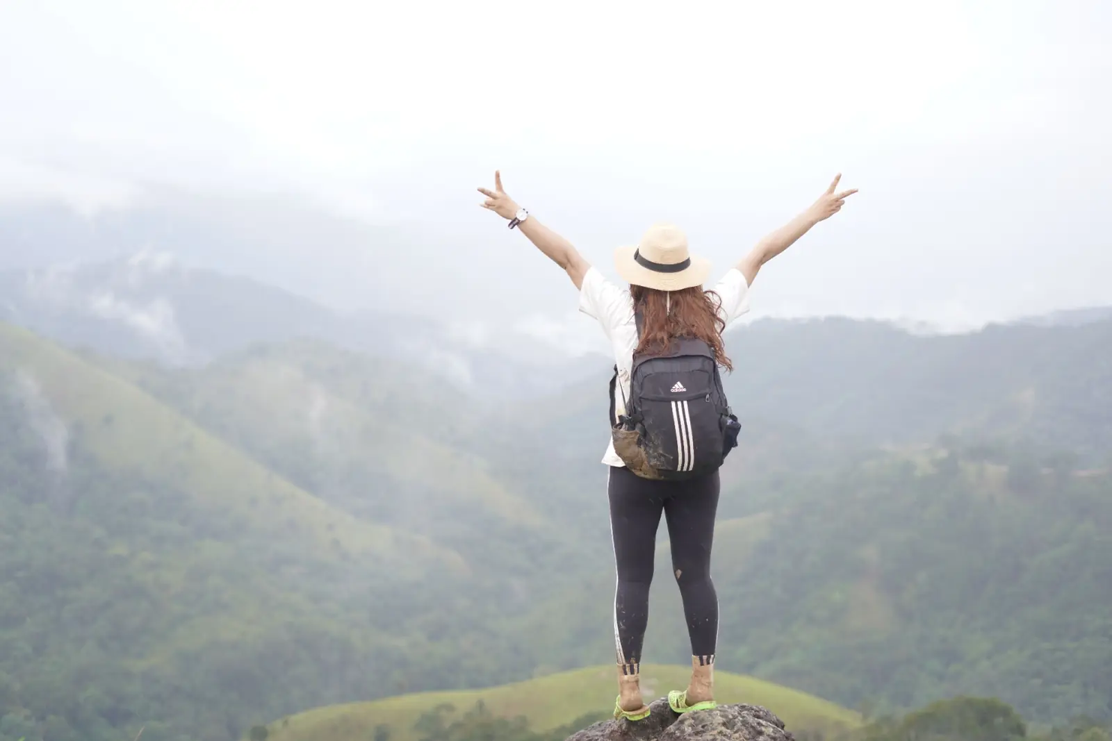 Traveler overlooking mountain valley